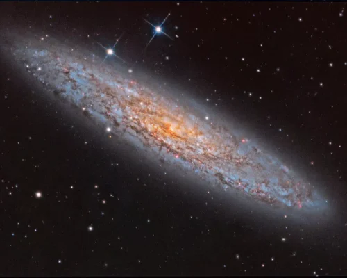 تصویر روز ناسا: NGC 253 کهکشان غبارآلود